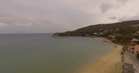 Aerial, empty beach and beautiful calm sea on cloudy day Stock-Footage 85560450