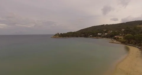 Aerial, empty beach and beautiful calm sea on cloudy day 스톡 동영상 86739140