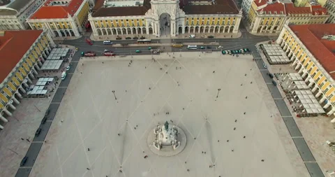 Aerial of empty square in Lisbon with memorial statue surrounded by buildings Stock Footage 155013805