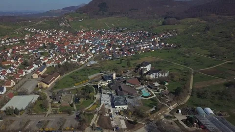 Aerial of the empty thermal bath in Beuren on the Swabian Alps, Germany on a Stock Footage 129706329