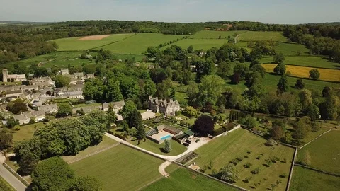 Aerial of English Country house in the Cotswolds in England Stock Footage