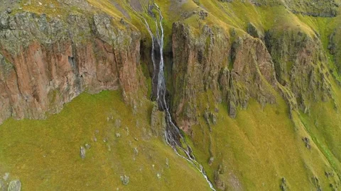 Aerial epic alpine waterfall falls from rocks natural landscape Elbrus Russia 4k Stock Footage 153257441