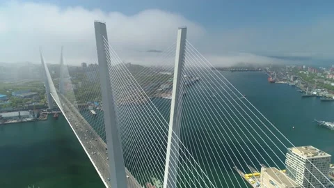 Aerial epic cable-stayed Golden Bridge Vladivostok Russia covered in clouds fog  Stock Footage 145313142