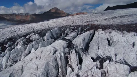 Aerial epic cracked sharp glacier melted on volcano Elbrus top Caucasus iceberg  Stock Footage 153352347
