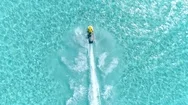 Aerial - Epic Shot Of A Jet Ski Racing On A Crystal Clear Water Stock Footage