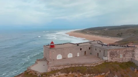 Aerial epic view over the lighthouse of Sao Miguel Fort and big Atlantic wa.. Stock Footage 239934570