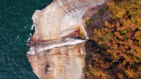 Aerial of Epic Waterfall Over Rough Sea Video stock 83894158
