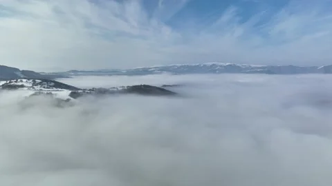 Aerial epic wilderness landscape. Flying over clouds, mountains, forest. winter 스톡 동영상 226901897