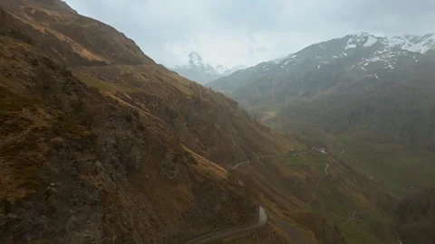 Aerial establishing shot of empty mountain road in Dolomites South Tyrol, Italy Video stock 261554900