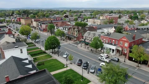Aerial establishing shot of Main Street, Small Town America, storefronts Stock Footage