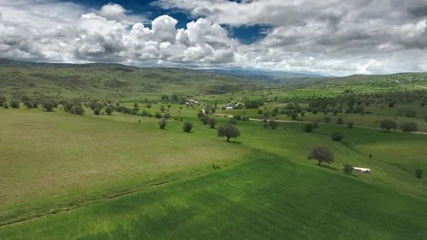 Aerial Europe farmland patchwork fields hills cultivated plains rural terrain Stock Footage 333762879