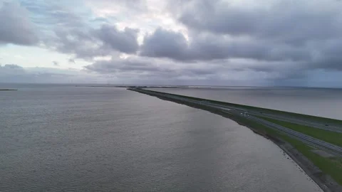 Aerial evening view of Afsluitdijk approach from above Stock-Footage 331828648
