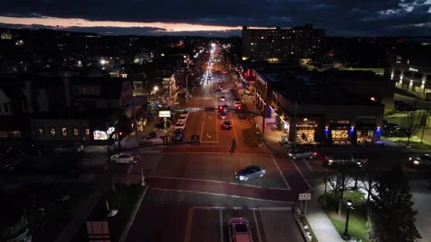 Aerial evening view of downtown Hershey, Pennsylvania, with traffic flowing Stock Footage 333330027