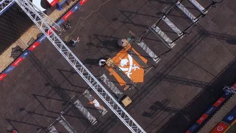 Aerial of an event set up in progress on the beach Stock Footage 85750442