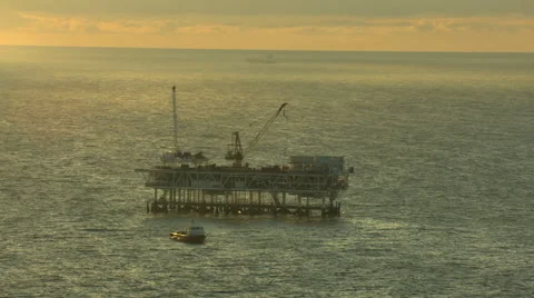Aerial Exploration Platform drilling Rig sunset Oil USA Stock Footage