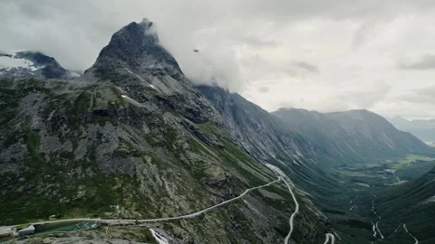 Aerial Exploring the Mountaintops Along Trollstigen Road Åndalsnes Norway 動画素材 330053998