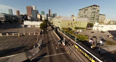 Aerial. Expressway train rides on the background of Downtown, LA, California Stock Footage 41494678