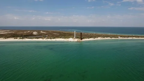 Aerial extra long shot of a lighthouse and a border tower on Dzharylhach  coast Stock-Footage 81570420