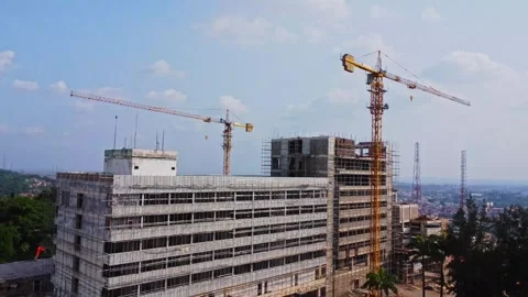 Aerial of the facade of the Premier hotel under renovation in Ibadan, Nigeria Stock Footage 312362707
