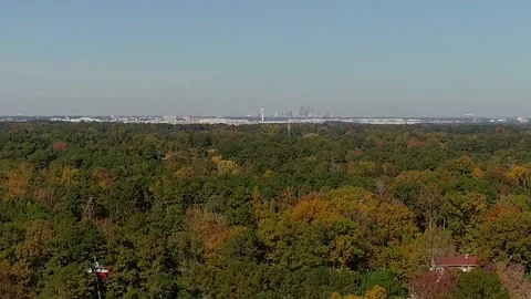 Aerial fall trees left to right side view of airport Stock Footage 170841642