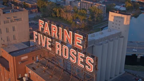Aerial: Farine Five Roses & Montreal City Skyline at sunrise. Quebec, Canada Stock Footage
