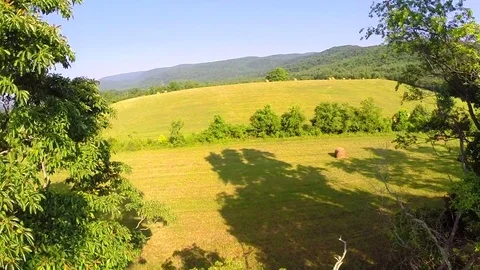 Aerial farm flyover summer Stock Footage
