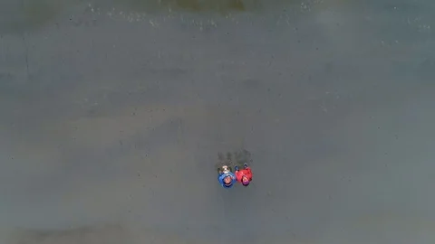 Aerial of Farstad sand beach with two traveller in Norway Stock Footage 100352168