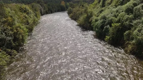 Aerial Fast Flight Upstream Over River Revealing Mountain Horizon in Lenca Stock Footage 325245619