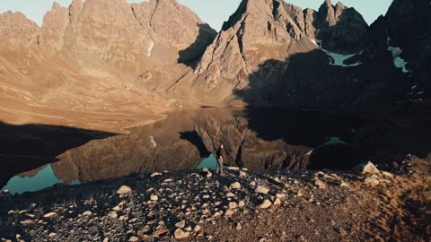Aerial fast motion view young male photographer working outdoors in mountai.. 動画素材 308092870