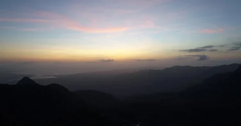 Aerial fast right to left pan of mountain sunset 스톡 동영상 81687204