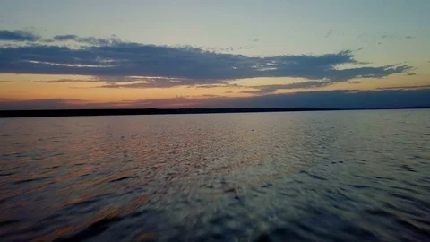Aerial fast view amazing sundown water surface sea drone footage Stock Footage