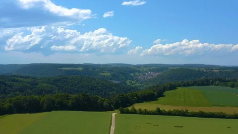 Aerial of fields and clouds in the black forest  Stock Footage 124679052