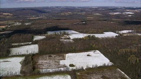 Aerial of fields covered with snow on the hilly river, Farmland covered in snow Stock Footage 109138329