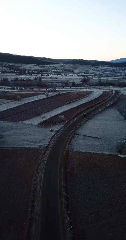 Aerial of fields during freezing, winter morning Video stock 143937746