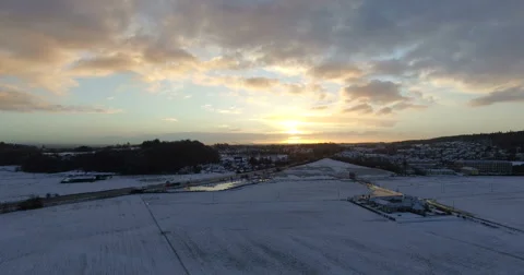 Aerial: Fields during winter covered with snow near Edinburgh, Scotland Stock Footage 65294749