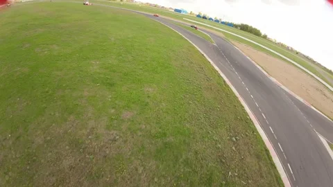 Aerial filming of a circuit race, fpv drone Stock Footage 247973553