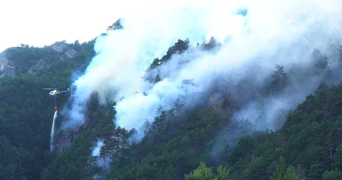 Aerial firefighting with helicopter Stock Footage 94943701