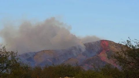 Aerial firefighting operations during a desert wildfire Stock Footage 74829458