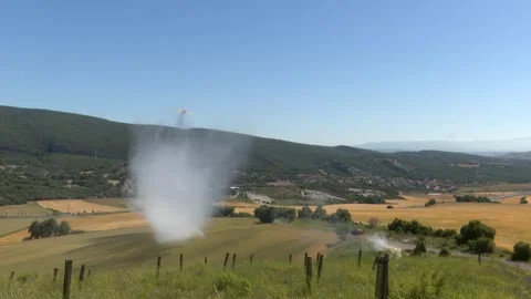 Aerial Firefighting Plane Dropping Water Over Rural Field to Extinguish Wild Видео 337058477