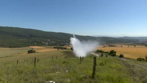 Aerial Firefighting Plane Dropping Water Over Rural Field to Extinguish Wild Видео 337058486