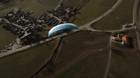 Aerial first person view of glider paragliding over valley Stock-Footage 149188136