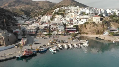 Aerial of fisher village in Mediterranean sea (Agia Galini) 4K drone footage Stock Footage
