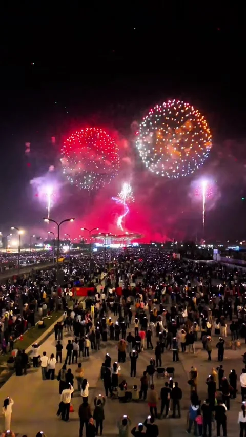 Aerial Fixed Shot of Crowd Watching Lunar New Year Fireworks in China Stock Footage 329258359