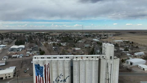 Aerial Flagler Colorado grain elevator In God We Trust climb 2 4K Stock Footage 239449950
