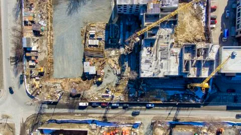 Aerial flat view of cranes on construction site of building in downtown 写真素材