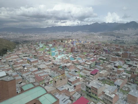 Aerial flies low over rooftops of Ciudad Bolviar to reveal the city of Bogota Stock-Footage 82097709