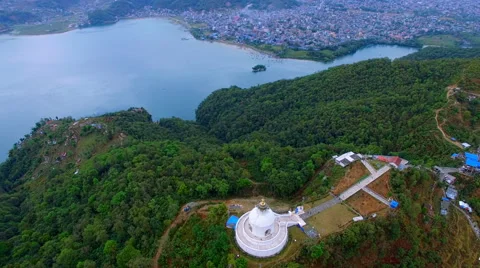 Aerial Flight 4k video over buddhist stupa Pokhara Valley Phewa lake Nepal Stock Footage 64826481