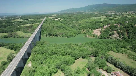 Aerial flight 4K view orbit rail bridge for HIGH Speed train above river Stock Footage 196234195