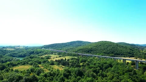 Aerial flight 4K view rail bridge Freccia Rossa Train passes by-Tuscany Italy Stock-Footage 196233408