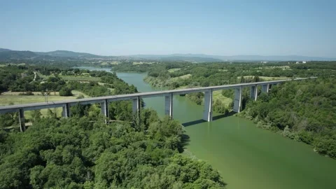 Aerial flight 4K view rail bridge pan cyrcle up Tuscany Italy Arno Dante river  스톡 동영상 196233489